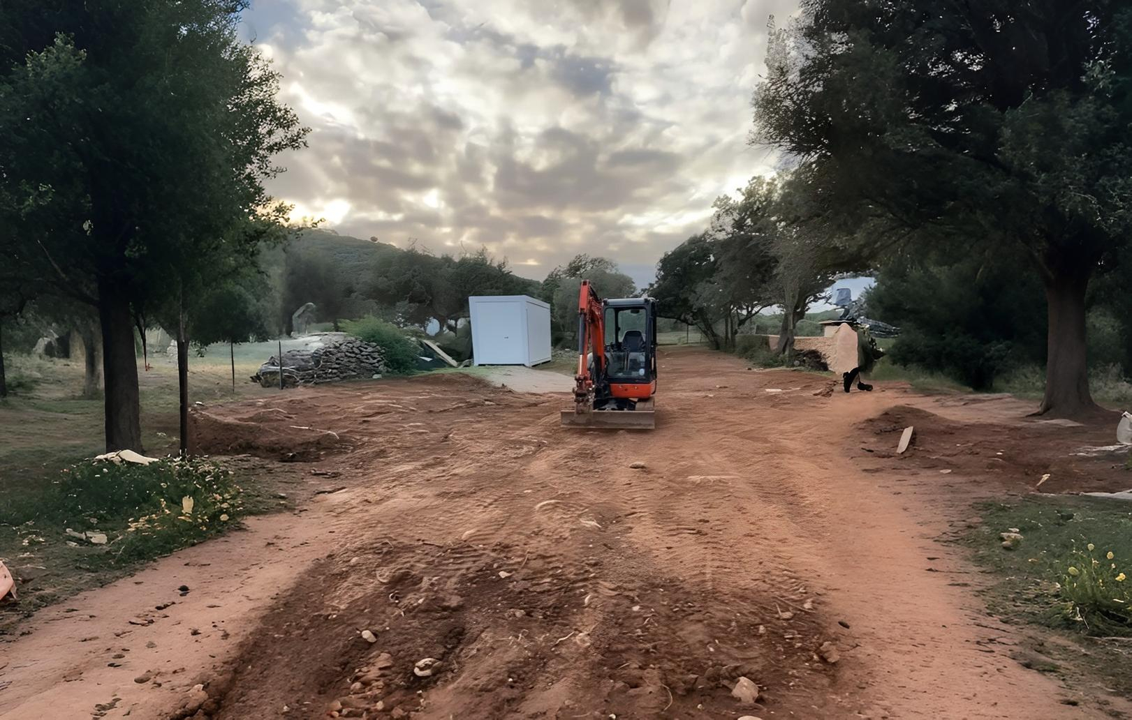 Laser-guided grading for patio sub-base with compact excavator and grade bar